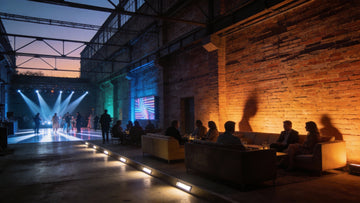 Event venue uplighting with stage beams