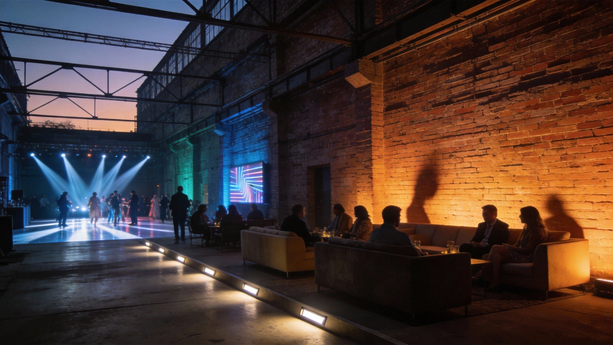 Event venue uplighting with stage beams