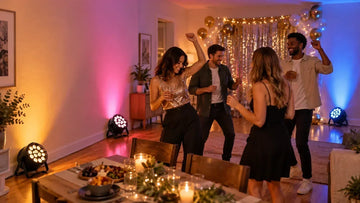 PAR lights fill a home party room with warm, pink, and blue color across dinner and dancing areas